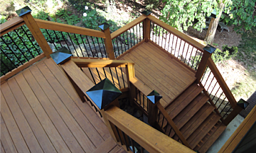 Wood stairs with aluminu rails and post caps, photo courtesy of Viance